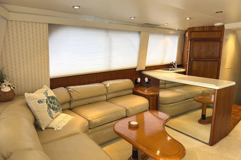 Slide: The Image of Interior of 1991 Viking 53 Convertible yacht with cozy seating and navigation screens. - 27