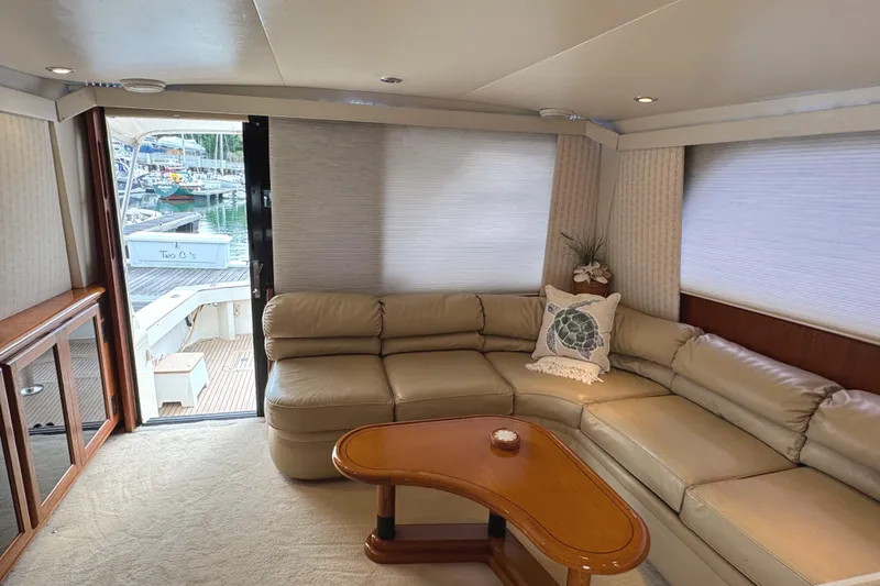 Slide: The Image of Interior of a 1991 Viking 53 Convertible yacht with modern amenities and wooden finishes. - 32