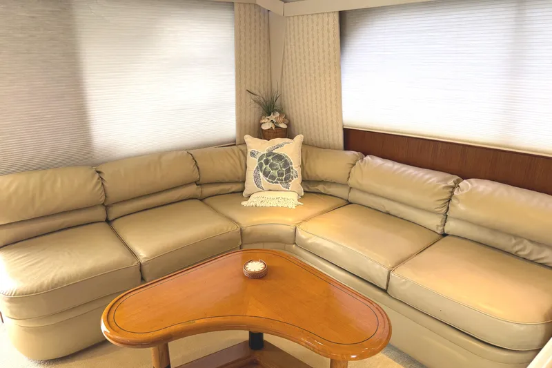 Slide: The Image of Interior of 1991 Viking 53 Convertible yacht with cozy seating and elegant decor. - 33