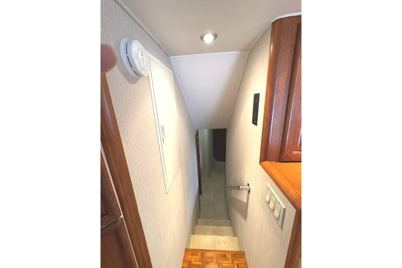 Slide: The Image of Luxurious kitchen interior of 1991 Viking 53 Convertible yacht with wood cabinetry and modern appliances. - 37