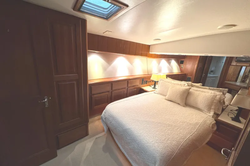 Slide: The Image of Interior staircase of 1991 Viking 53 Convertible yacht with wooden accents and smoke detector. - 40