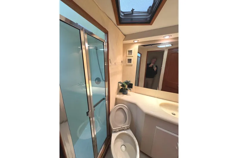 Slide: The Image of Bathroom interior of 1991 Viking 53 Convertible yacht with shower and skylight. - 49