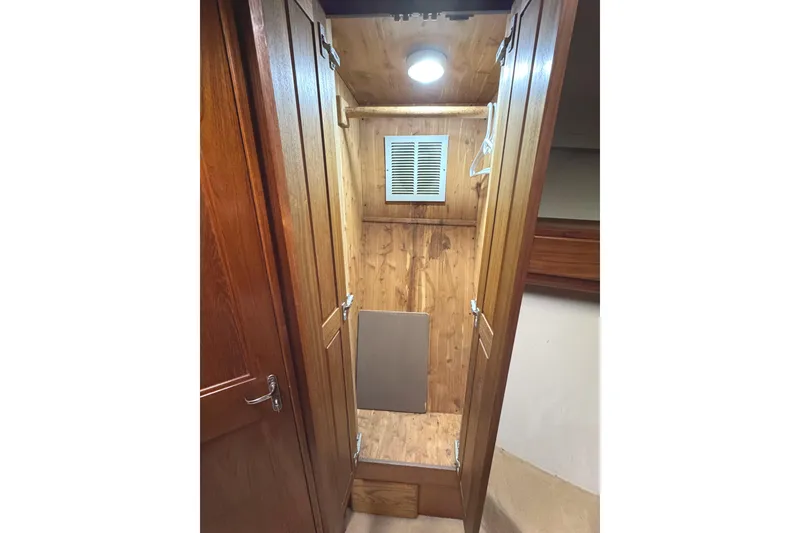 Slide: The Image of Bathroom interior of 1991 Viking 53 Convertible yacht with skylight and vanity. - 54