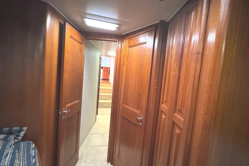 Slide: The Image of Interior of 1991 Viking 53 Convertible yacht with bunk beds and wood paneling. - 56