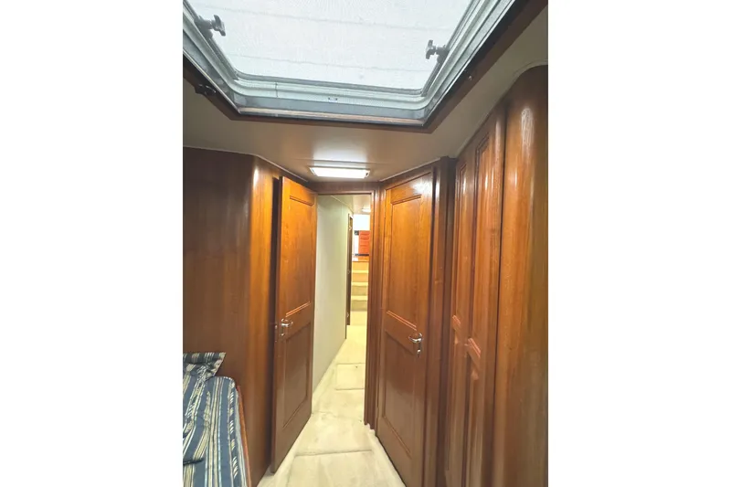 Slide: The Image of Wooden closet interior on a 1991 Viking 53 Convertible boat. - 57