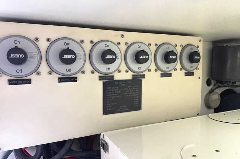 Slide: The Image of Interior hallway of 1991 Viking 53 Convertible yacht with wooden doors and soft lighting. - 59