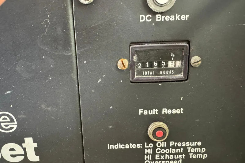 Slide: The Image of Electrical panel inside 1991 Viking 53 Convertible boat, featuring labeled switches and wooden frame. - 61