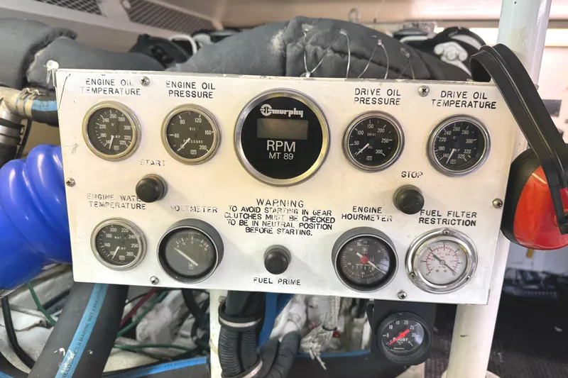 Slide: The Image of Control panel of a 1991 Viking 53 Convertible boat with multiple switches. - 62