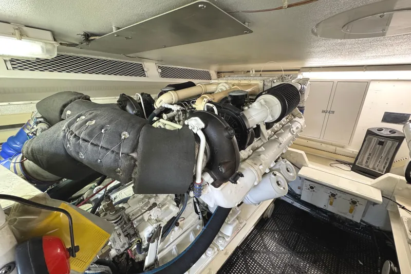 Slide: The Image of Control panel of a 1991 Viking 53 Convertible boat with various gauges and indicators. - 65