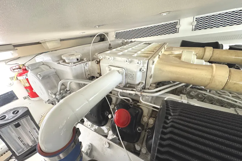 Slide: The Image of Engine room of a 1991 Viking 53 Convertible yacht, showcasing detailed machinery. - 70