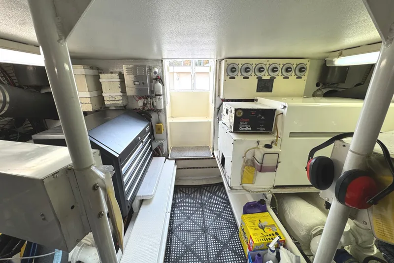 Slide: The Image of Engine room of a 1991 Viking 53 Convertible yacht, showcasing detailed mechanical components. - 73