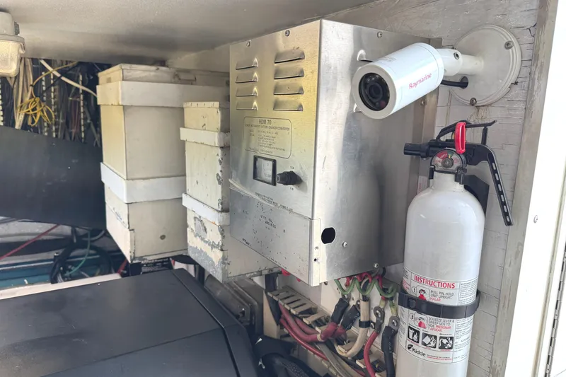 Slide: The Image of Engine room of a 1991 Viking 53 Convertible yacht, showcasing mechanical components. - 74