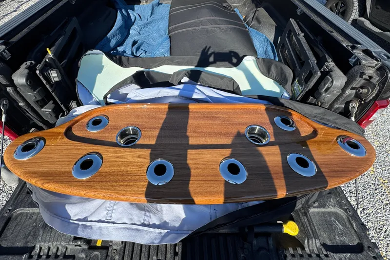 Slide: The Image of Storage compartment with boat propellers, tools, and hoses from a 1991 Viking 53 Convertible. - 79