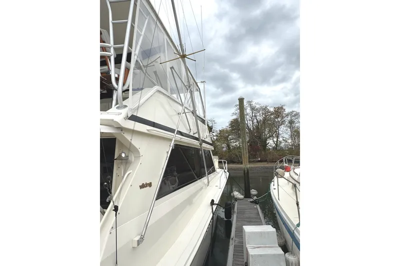 Slide: The Image of Camera mounted on 1991 Viking 53 Convertible yacht under cloudy sky. - 87