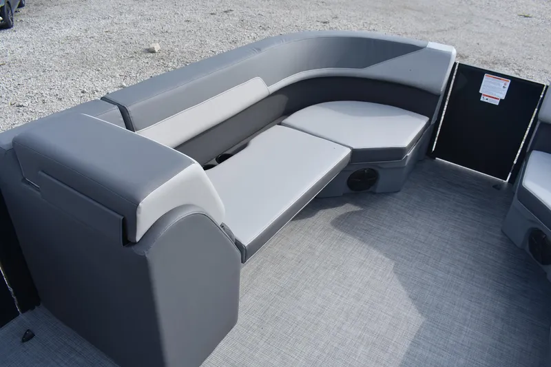 Slide: The Image of 2026 Lowe LS 210 boat interior with gray seating and modern design. - 12