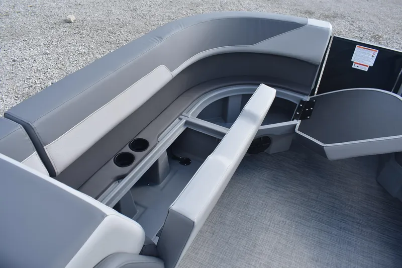 Slide: The Image of Interior view of 2026 Lowe LS 210 boat with gray seating and storage compartments. - 13