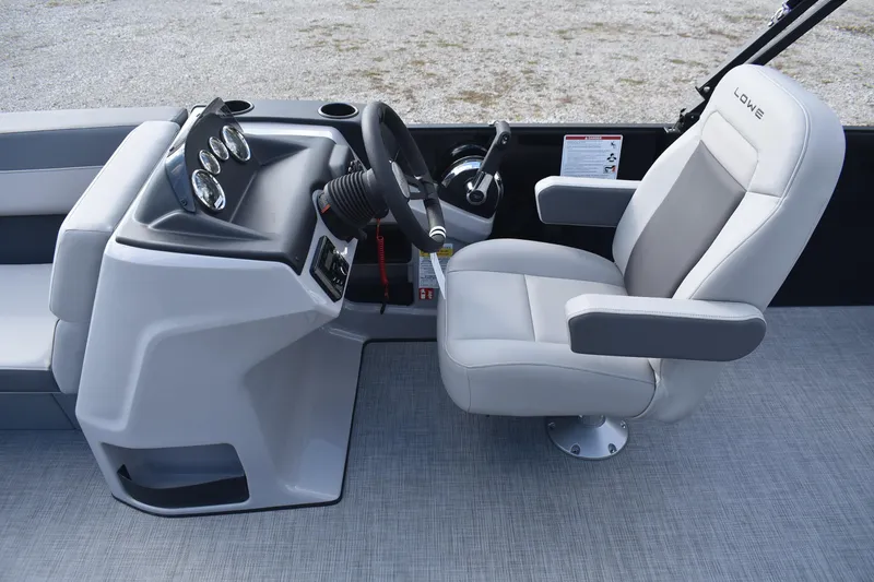 Slide: The Image of Captain's seat and console of 2026 Lowe LS 210 boat, featuring modern controls and gauges. - 15