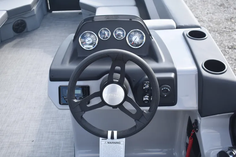 Slide: The Image of Steering console of 2026 Lowe LS 210 boat with gauges and controls. - 16