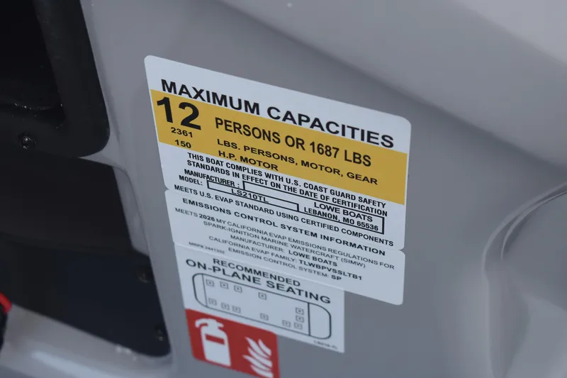 Slide: The Image of Capacity label on 2026 Lowe LS 210 boat, showing 12-person or 1687 lbs limit. - 17
