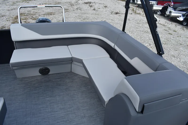 Slide: The Image of 2026 Lowe LS 210 boat interior with gray cushioned seating on a textured floor. - 18