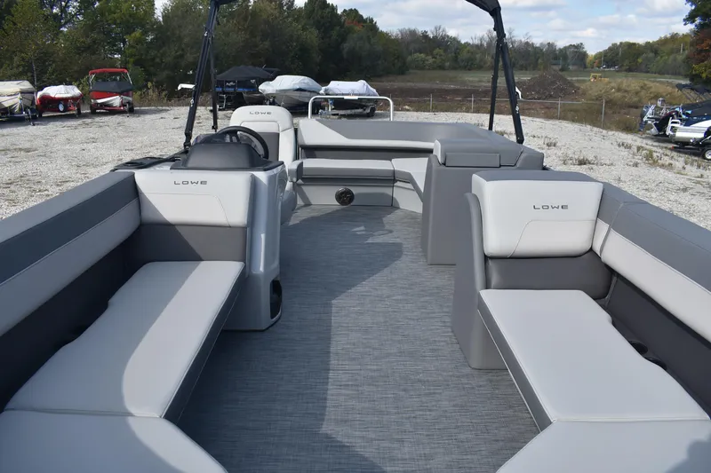 Slide: The Image of 2026 Lowe LS 210 pontoon boat with spacious seating and modern design. - 2