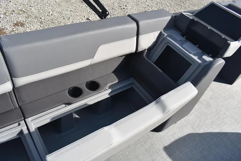 Slide: The Image of 2026 Lowe LS 210 boat interior with gray seating and cup holders. - 20