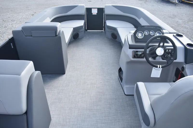Slide: The Image of Interior of 2026 Lowe LS 210 pontoon boat with modern seating and steering console. - 3