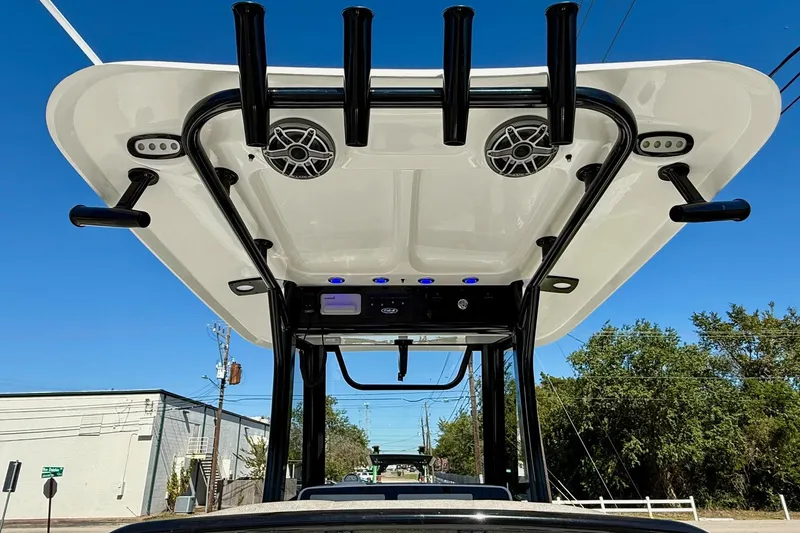 Slide: The Image of 2026 Sea Hunt Ultra 265 SE boat top view with speakers and rod holders. - 11