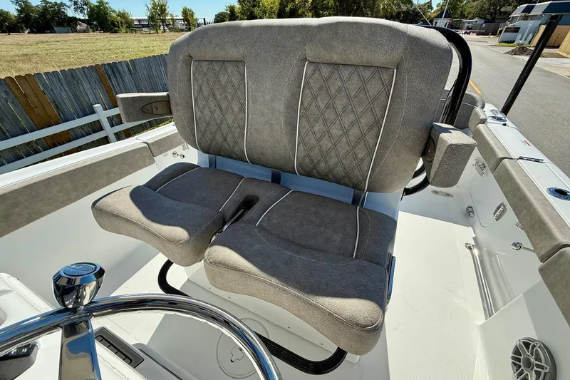 Slide: The Image of 2026 Sea Hunt Ultra 265 SE boat seats with diamond stitching and armrests. - 9