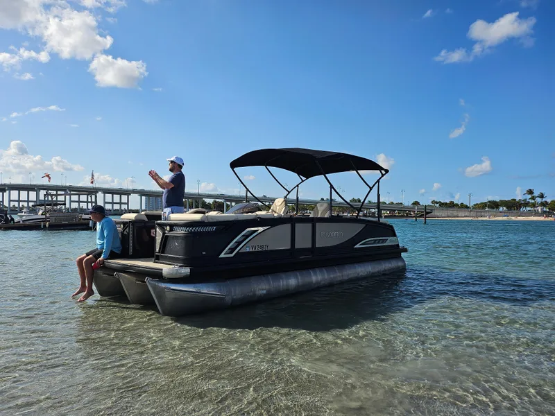 The Image of 2020 Godfrey Sanpan 2400 SBC pontoon boat on clear water under blue sky. - 0