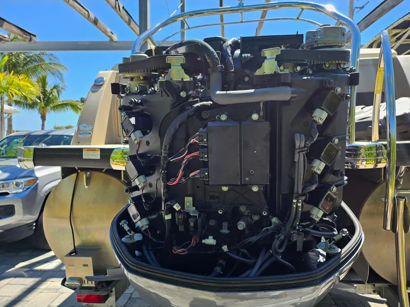Slide: The Image of 2020 Godfrey Sanpan 2400 SBC boat engine, detailed view, parked outdoors. - 12