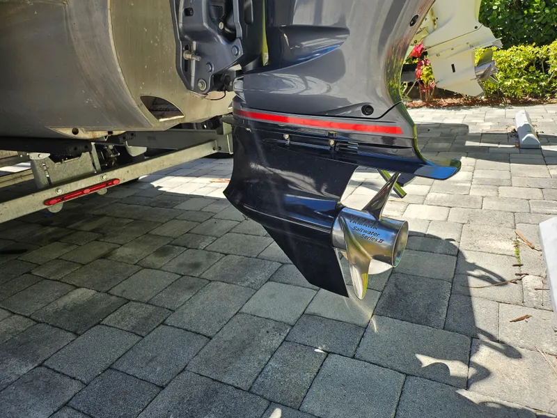 Slide: The Image of Outboard motor of 2020 Godfrey Sanpan 2400 SBC on a paved surface. - 14