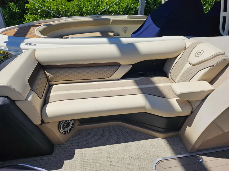 Slide: The Image of Luxurious seating on 2020 Godfrey Sanpan 2400 SBC pontoon boat, featuring elegant beige upholstery. - 16