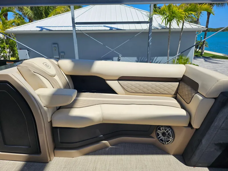 Slide: The Image of Luxurious seating on 2020 Godfrey Sanpan 2400 SBC pontoon boat, featuring beige upholstery. - 17