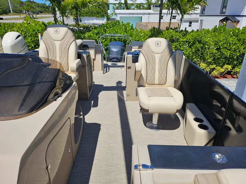 Slide: The Image of 2020 Godfrey Sanpan 2400 SBC pontoon boat interior with luxurious seating and modern design. - 18