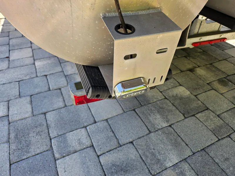 Slide: The Image of 2020 Godfrey Sanpan 2400 SBC boat trailer hitch on paved surface. - 32