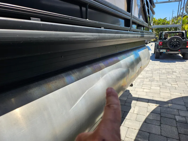 Slide: The Image of Close-up of a dent on a 2020 Godfrey Sanpan 2400 SBC pontoon boat. - 34