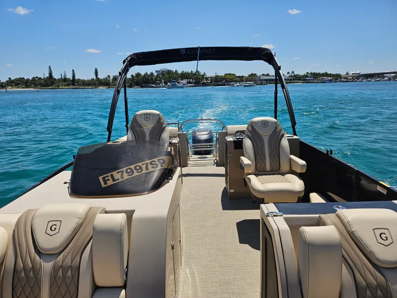 Slide: The Image of 2020 Godfrey Sanpan 2400 SBC pontoon boat on clear blue water. - 38