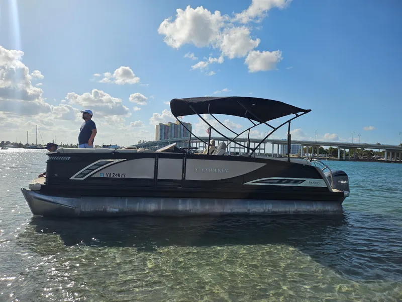 Slide: The Image of 2020 Godfrey Sanpan 2400 SBC pontoon boat on clear water under blue sky. - 39