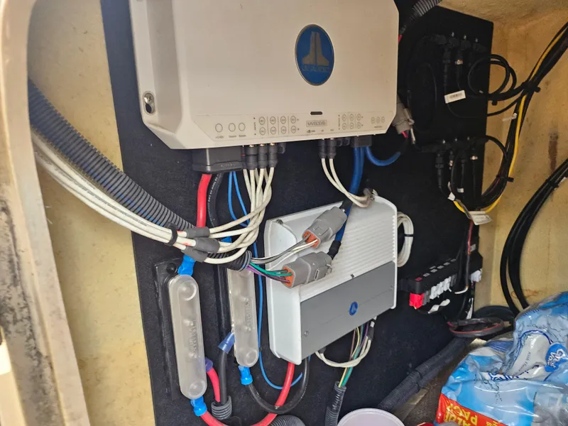 Slide: The Image of Electrical components and wiring inside a 2020 Godfrey Sanpan 2400 SBC boat. - 8