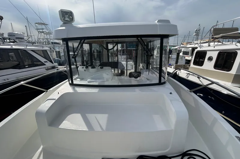 Slide: The Image of 2020 Beneteau Barracuda 9 boat docked, showcasing cockpit and helm station. - 5