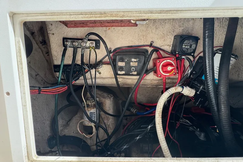 Slide: The Image of Electrical wiring and components inside a 2002 Aquasport 225 Osprey boat. - 22