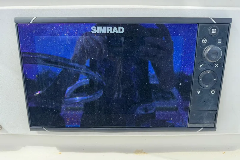 Slide: The Image of Simrad marine display on 2002 Aquasport 225 Osprey boat dashboard. - 9