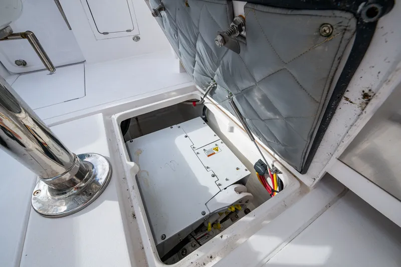 Slide: The Image of Open hatch on 2020 Intrepid 407 Panacea boat, revealing internal components and wiring. - 12