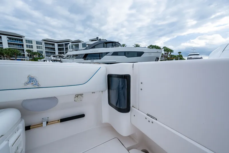 Slide: The Image of 2020 Intrepid 407 Panacea boat interior with marina view in the background. - 15