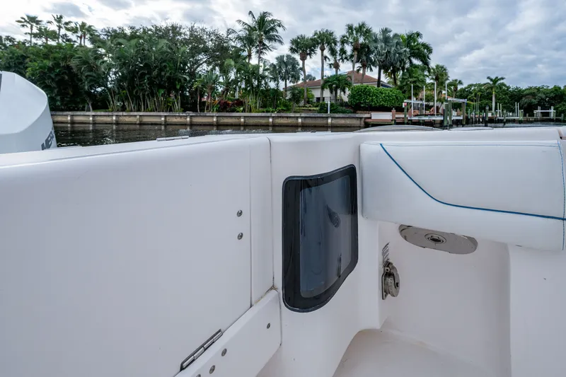 Slide: The Image of 2020 Intrepid 407 Panacea boat interior with waterfront view and lush greenery. - 16