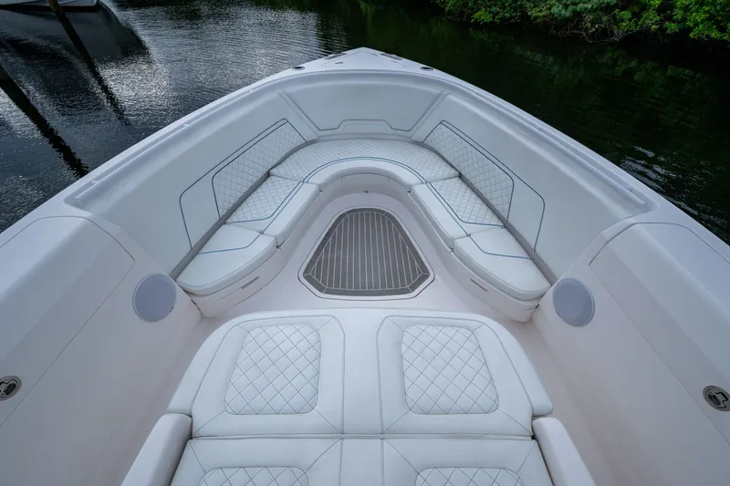 Slide: The Image of Luxurious seating area on 2020 Intrepid 407 Panacea boat, featuring elegant white upholstery. - 21