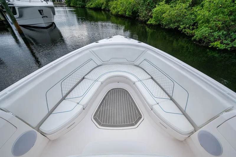 Slide: The Image of 2020 Intrepid 407 Panacea boat with spacious seating and elegant design on calm water. - 22