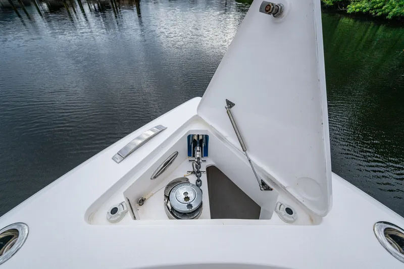 Slide: The Image of 2020 Intrepid 407 Panacea boat anchor compartment, open on calm water. - 28