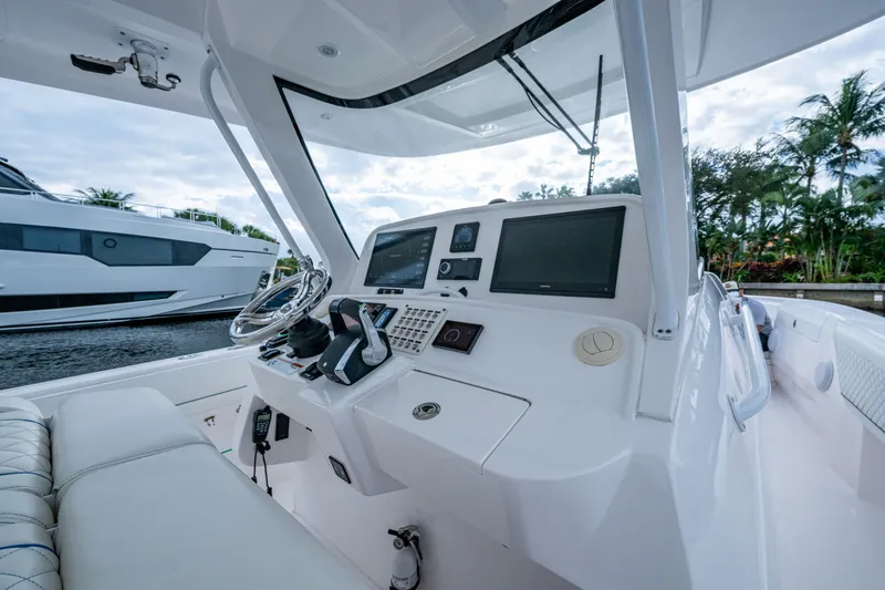 Slide: The Image of Intrepid 407 Panacea 2020 boat helm with modern controls and dual screens. - 3